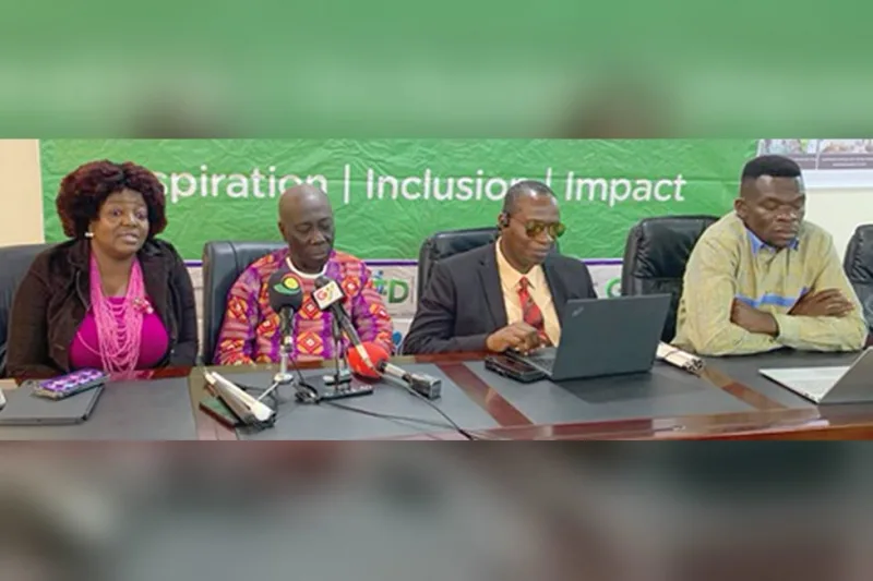 Eyram Bashan, Yaw Ofori Debrah and Alex Williams seated at a press table with microphones, under a GFD banner reading Inspiration, Inclusion, Impact.