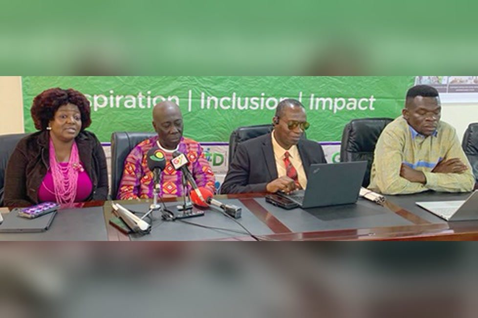 Eyram Bashan, Yaw Ofori Debrah and Alex Williams seated at a press table with microphones, under a GFD banner reading Inspiration, Inclusion, Impact.