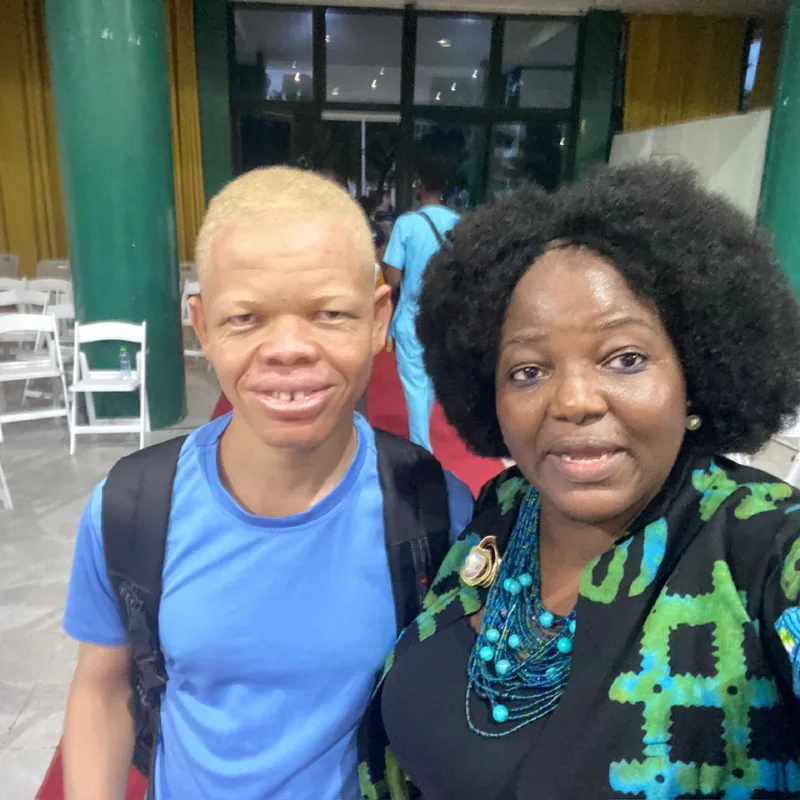 Eyram Bashan with an advocate at an event.