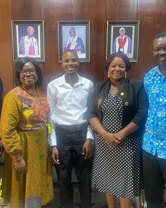 Eyram Bashan with a delegation at a church administrative office.