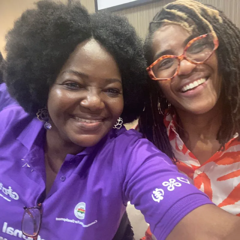 Eyram Bashan with a colleague at an International Day of Persons with Disabilities event.