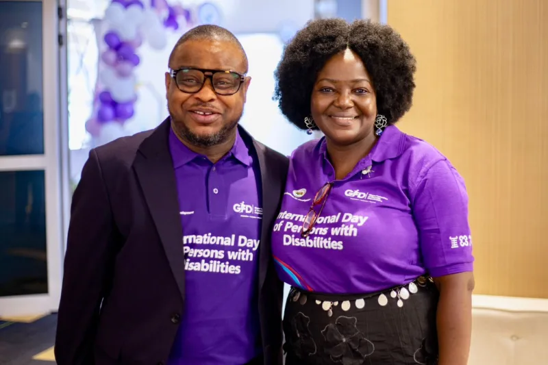 Eyram Bashan with a colleague in Ghana Federation of Disability Organisations apparel on International Day of Persons with Disabilities.